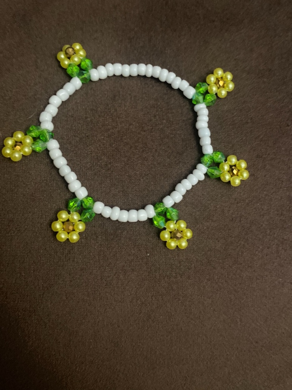 Handmade Beaded Bracelet with Yellow Flower Accents